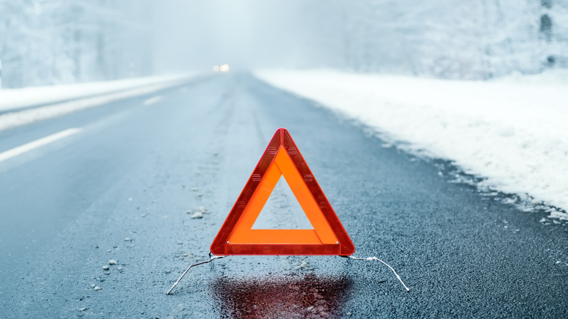 hazard road triangle on winter road