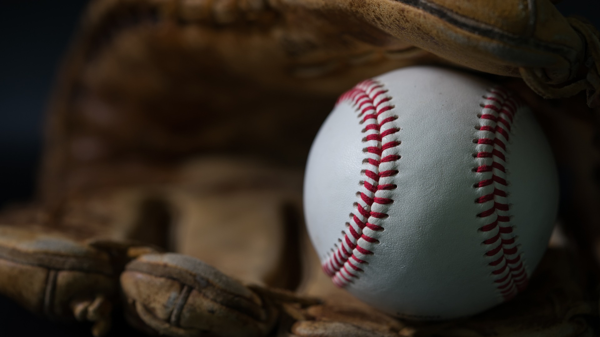 baseball in a baseball mitt