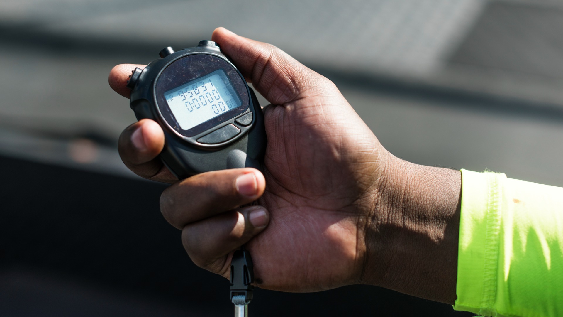 person holding a stopwatch