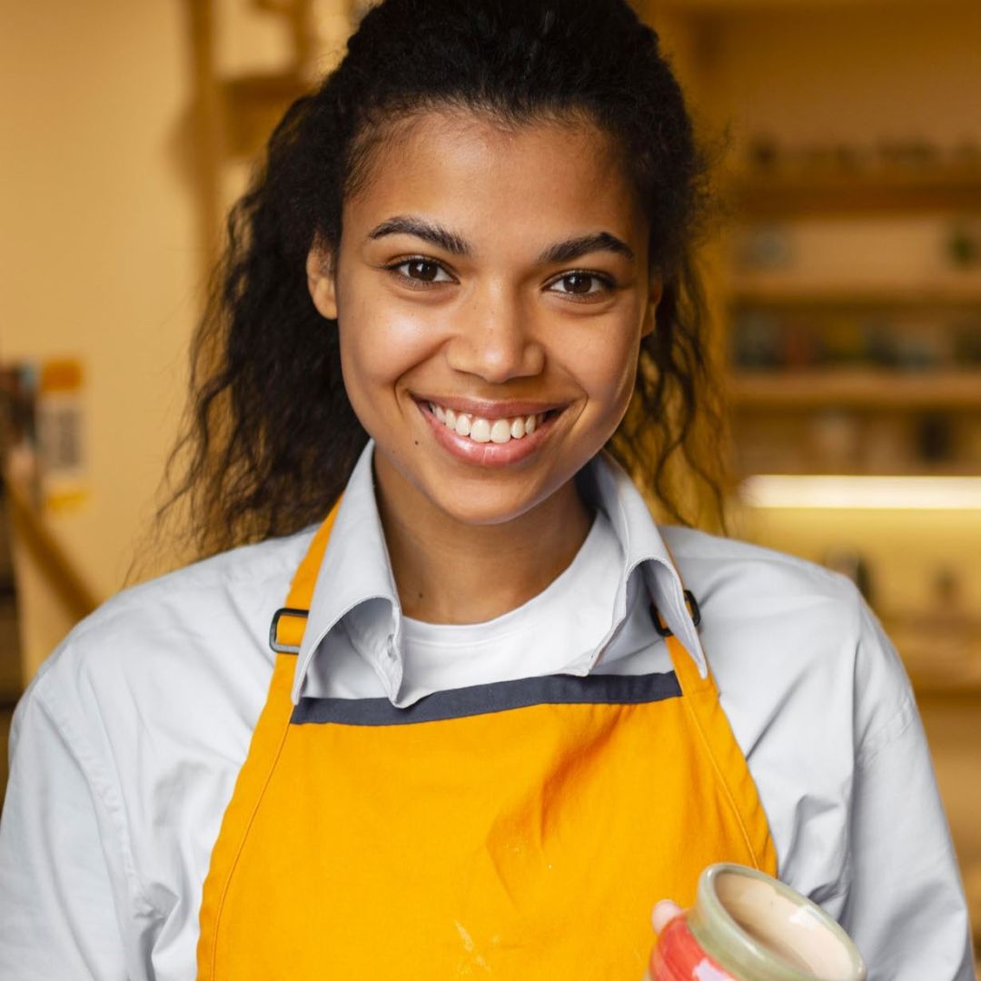 Woman holding pottery creation