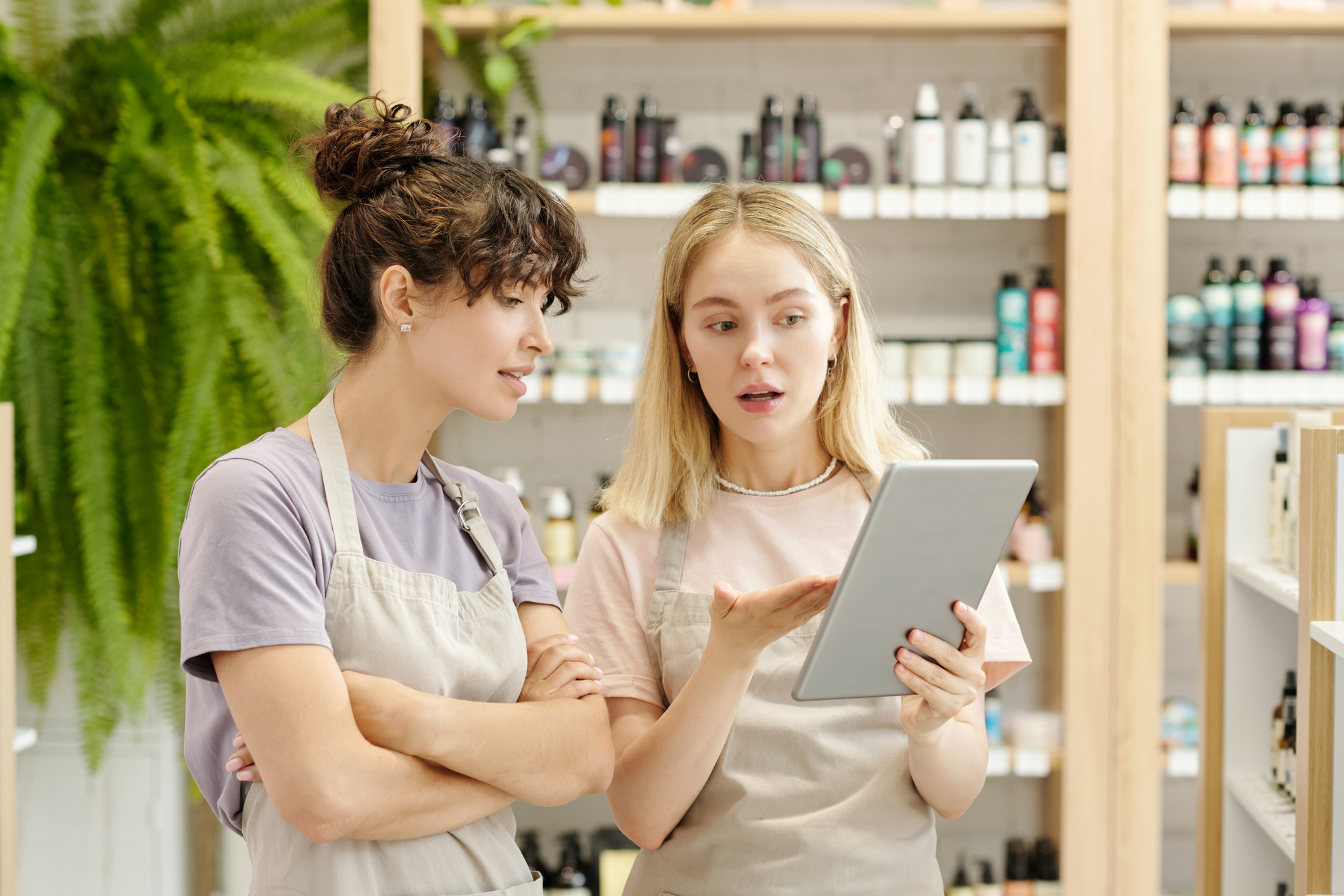 Two store workers in a beauty product shop
